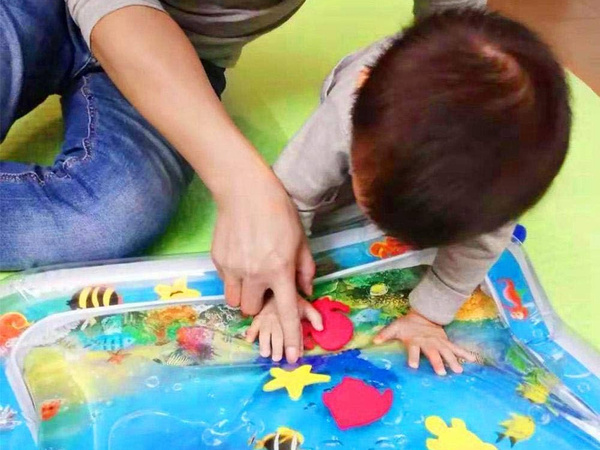 Inflatable sensory water mat for toddlers to play on