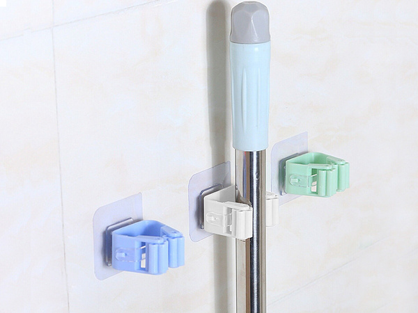 Self-adhesive brush holder for stick mop
