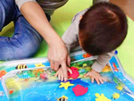 Inflatable sensory water mat for toddlers to play on