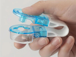 Pill remover for squeezing pills out of packs