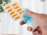 Pill remover for squeezing pills out of packs