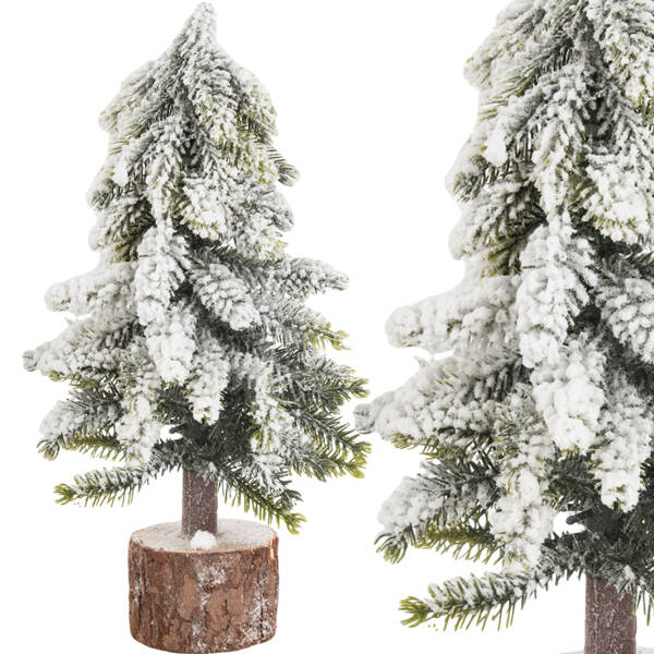 Künstlicher weihnachtsbaum schnee kleine dekorative schreibtisch auf stamm dick verschneit