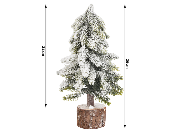 Künstlicher weihnachtsbaum schnee kleine dekorative schreibtisch auf stamm dick verschneit