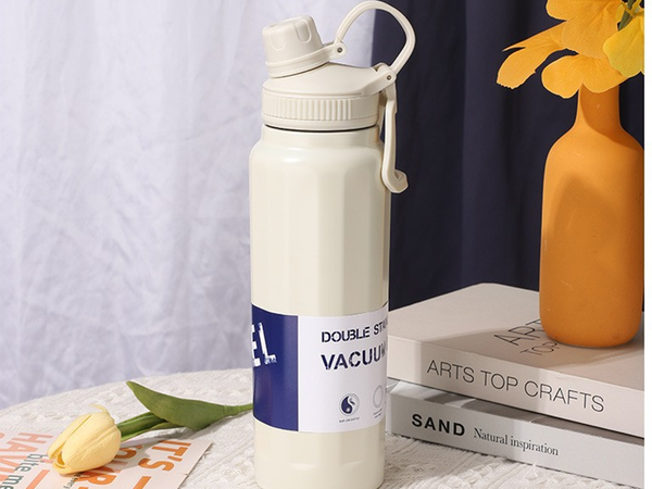 Termo térmico con asa, capacidad 700 ml, para bebidas frías y calientes.