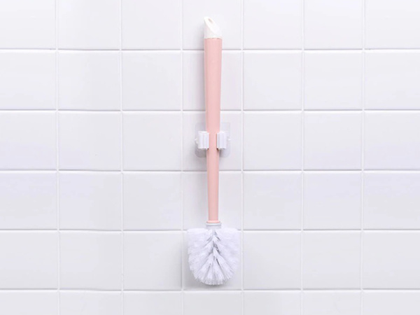 Self-adhesive brush holder for stick mop