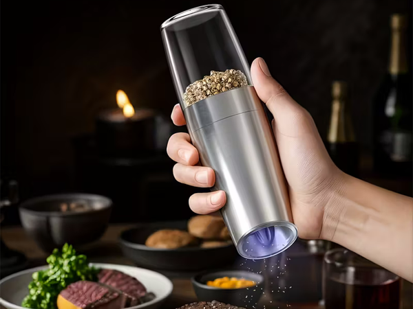 Electric gravity pepper and salt mill with lighting and adjustment