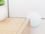 Door handle bumper self-adhesive to walls