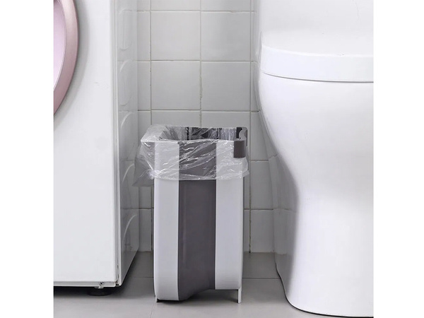 Folding basket for bio waste hanging on the cabinet