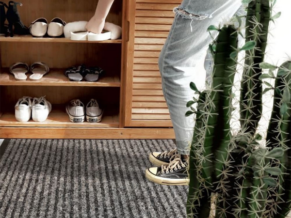 Rubberized doormat for shoes under the front door of the house 60 x 90